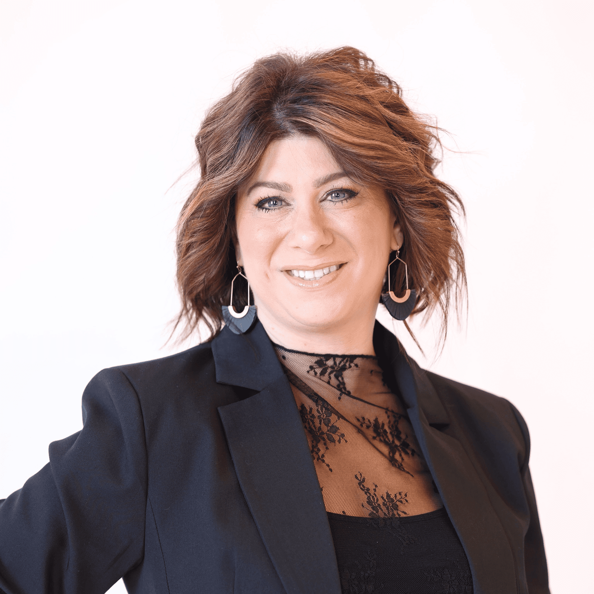 Portrait of Kristin Raffael, a professional stylist at AILISH & ASTON SALON AND SPA, showcasing their expertise and style.