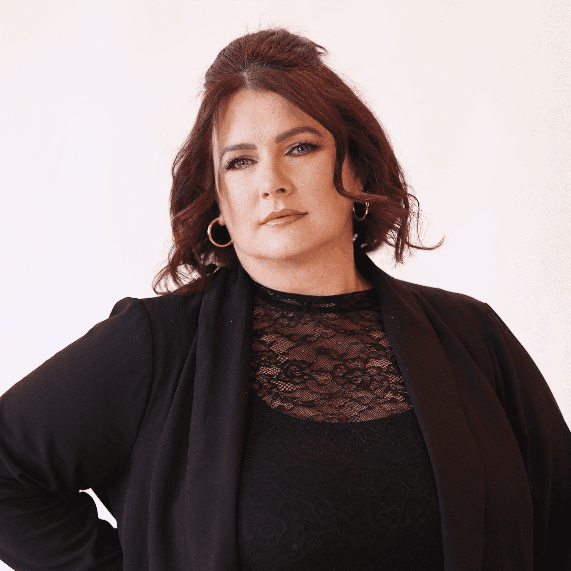 Portrait of Kristen Graham, a professional stylist at AILISH & ASTON SALON AND SPA, showcasing their expertise and style.