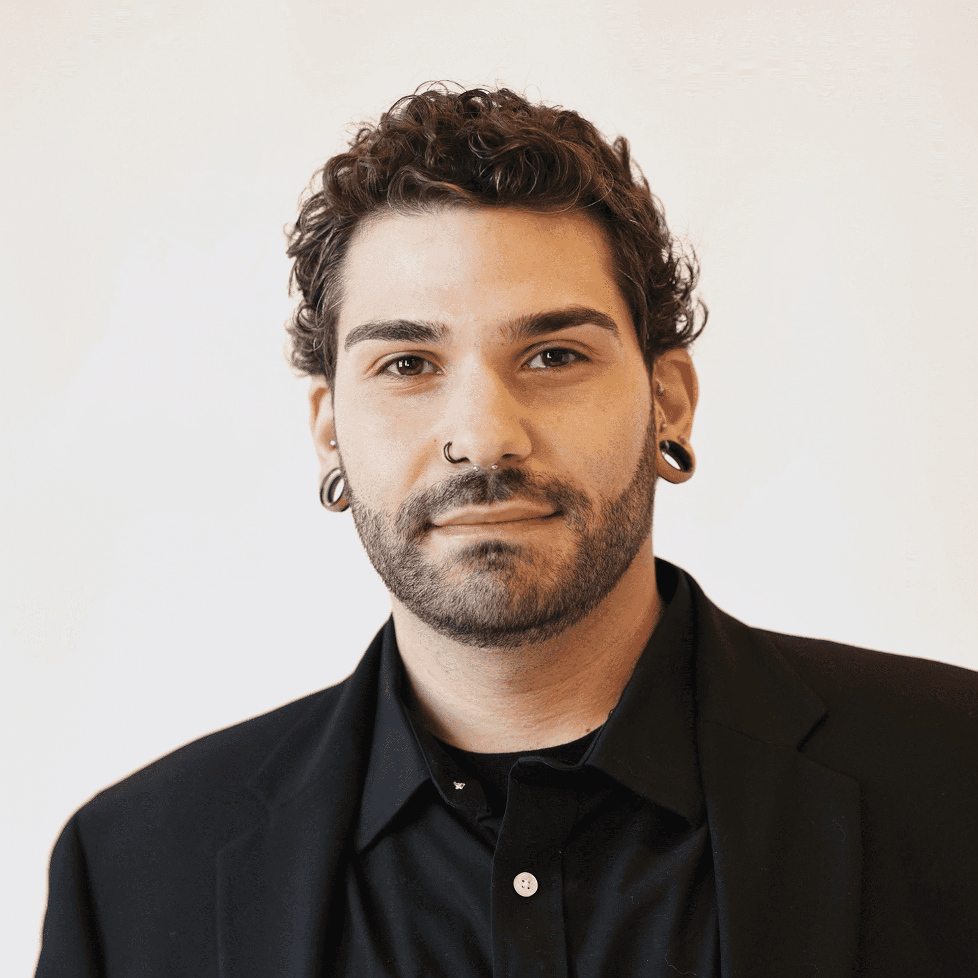 Portrait of Andrew Scordamalgia, a professional stylist at AILISH & ASTON SALON AND SPA, showcasing their expertise and style.